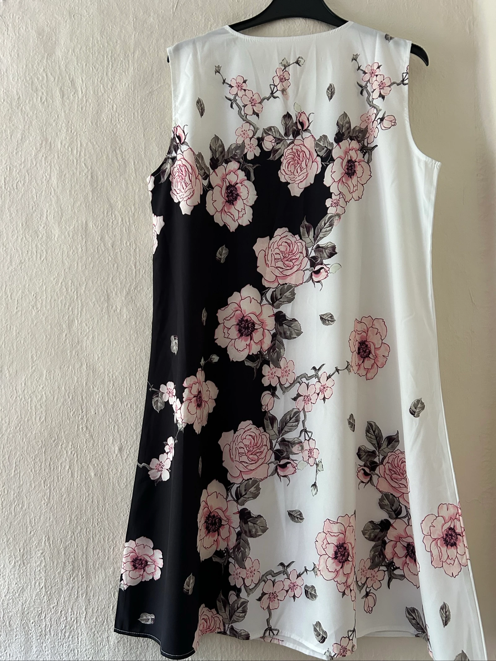 sleeveless in black and white with a delicate pink floral print.